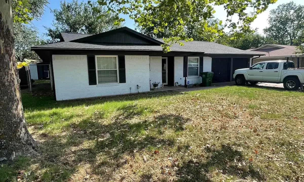 Professional roofing crew working on a residential roof in Deltona